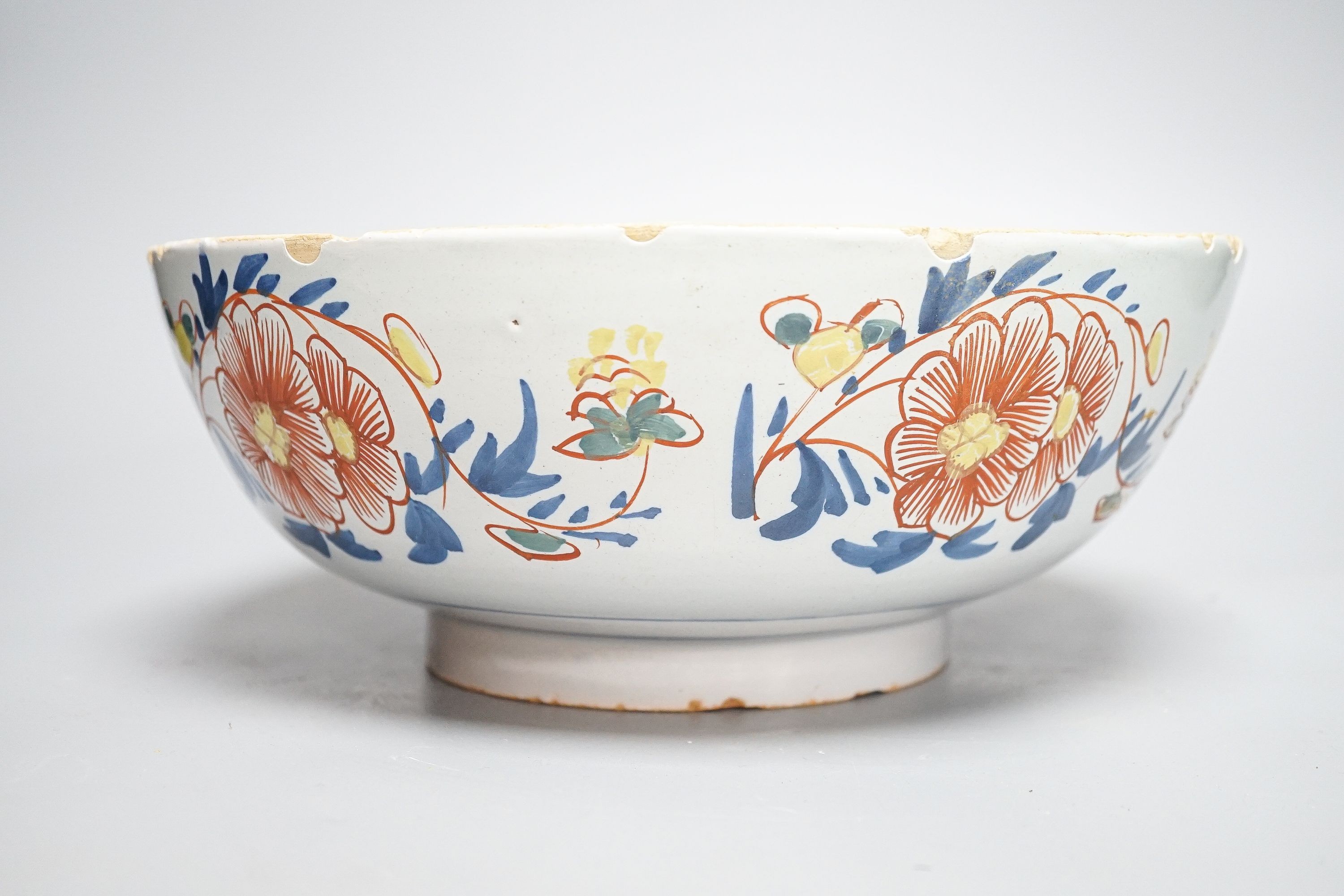 An 18th century English polychrome delftware bowl, interior inscribed 